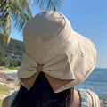 Women's sun hat with bow and wide brim – foldable, 360° protection